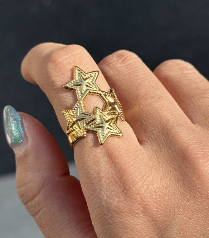 Anillo estrellas doradas