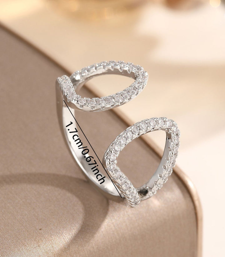 Anillo abierto con zirconias