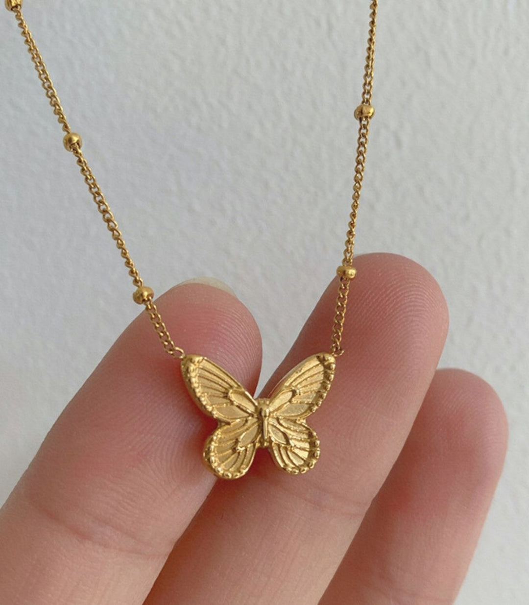 Collar mariposa